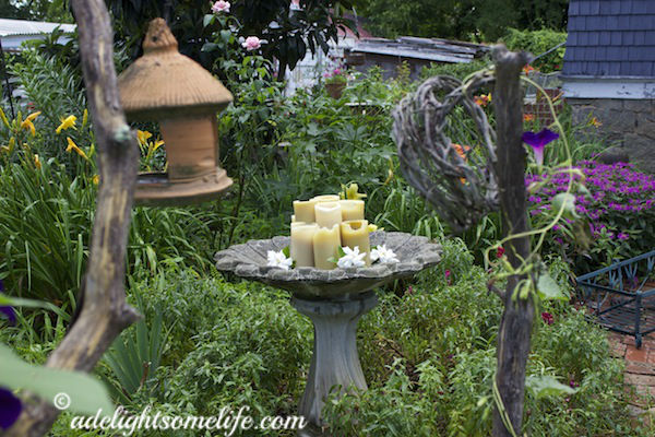 Cottage Garden Decor beeswax candles in birdbath