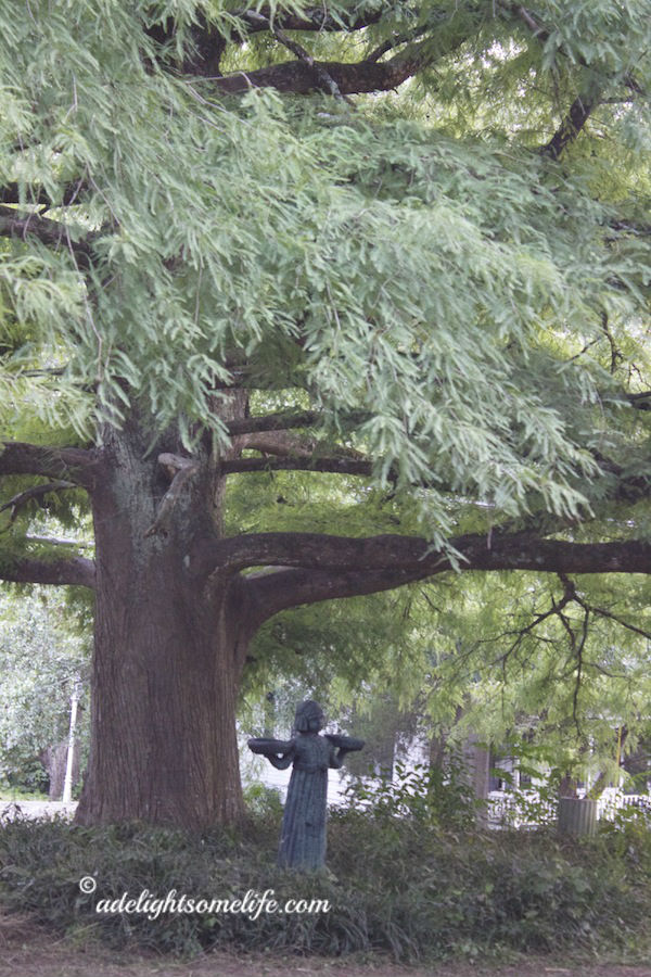 Bird Girl Statue under Cypress tree adelightsomelife.com