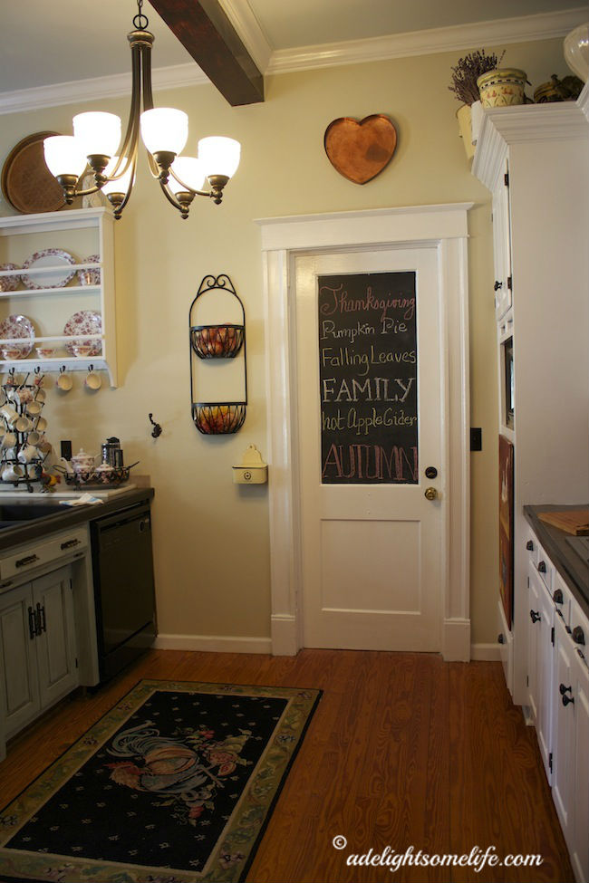 love the chalkboard - there's chalk stored in the yellow salt container on the side of the door