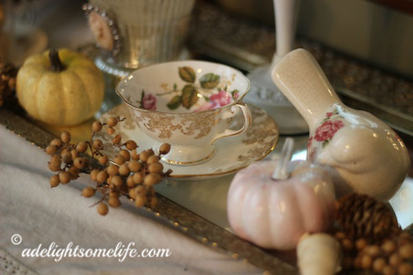 mirrored tray teacup bird autumn vignette