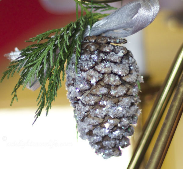 glittered pinecone with evergreen