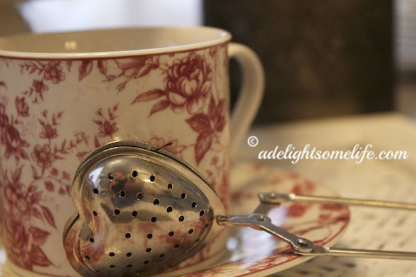 transferware teacup, tea strainer, 