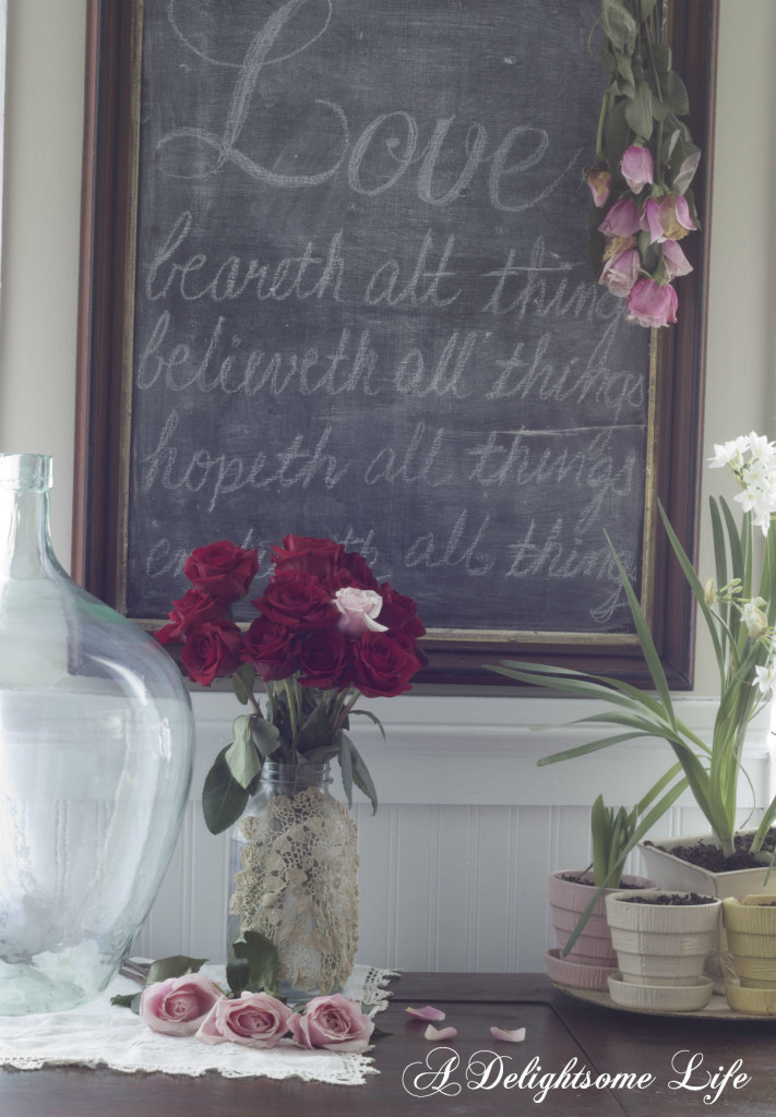 red roses and love on chalkboard