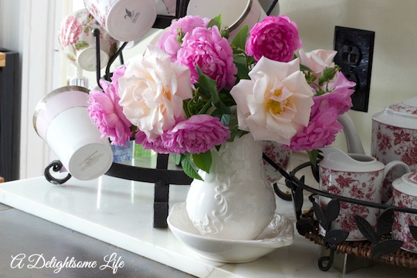 A DELIGHTSOME LIFE ROSES BY FRENCH BOTTLE RACK