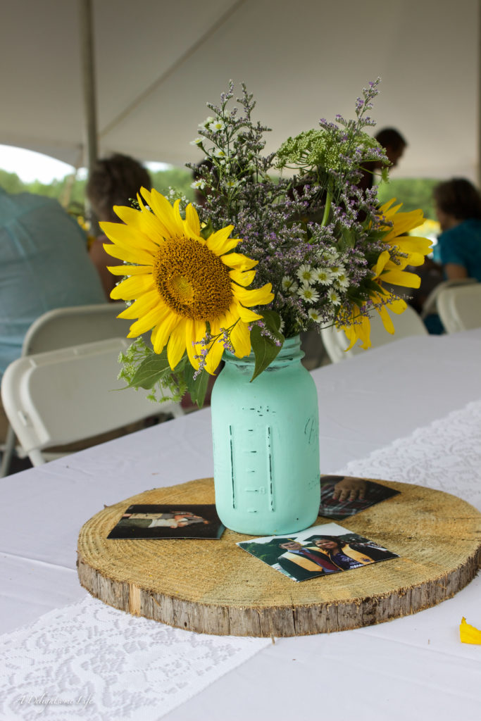 Wedding in Sunflower field: Mason jars pained a lovely aqua were perfect for the colorful, airy bouquets featuring sunflowers...for my daughter's wedding in a sunflower field