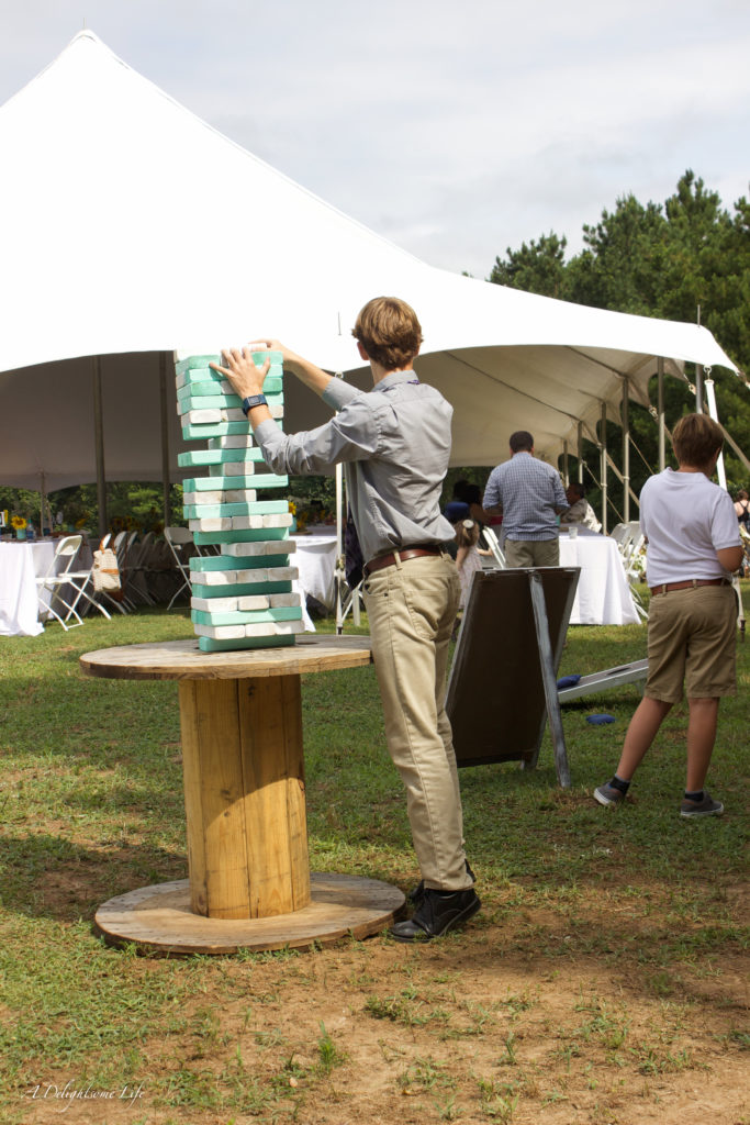 my son-in-law made this awesome large JENGA game for guests at their wedding in a sunflower field