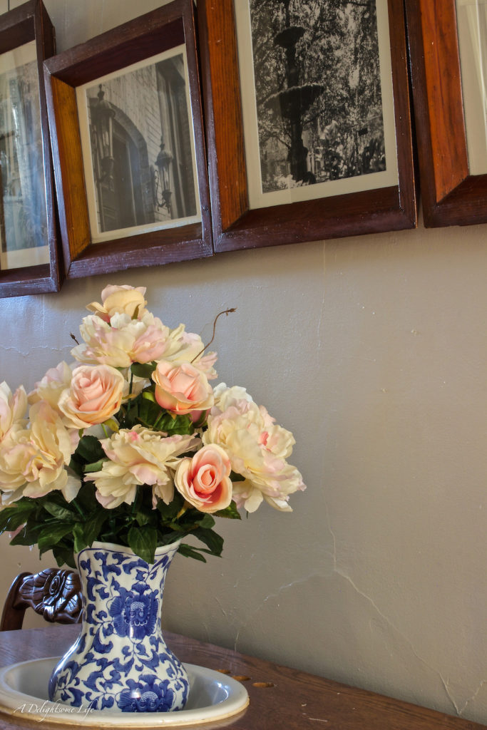 Upper Hallway transformation began with changing wall color, the blue and white pitcher with pink flowers led to the French influence decor changes
