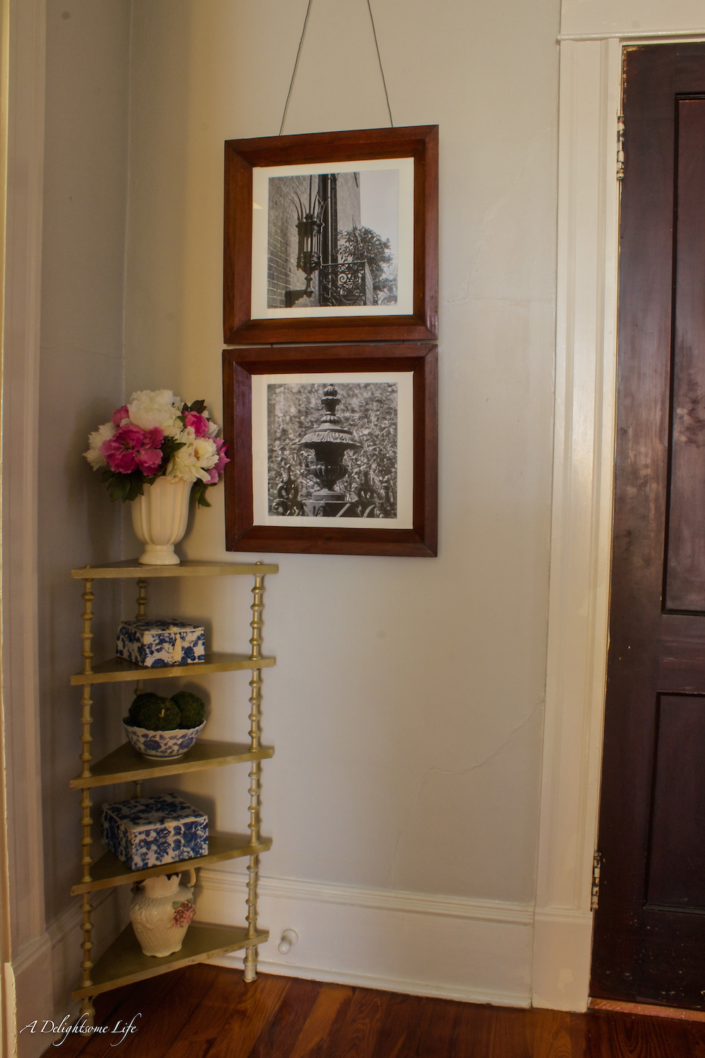 Painting the walls in the upper hallway led to changing the decor including painting this small shelf