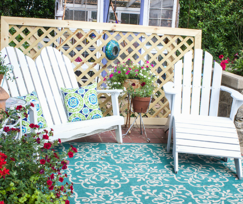 Updating the front porch for summer by painting the furniture bright green and white