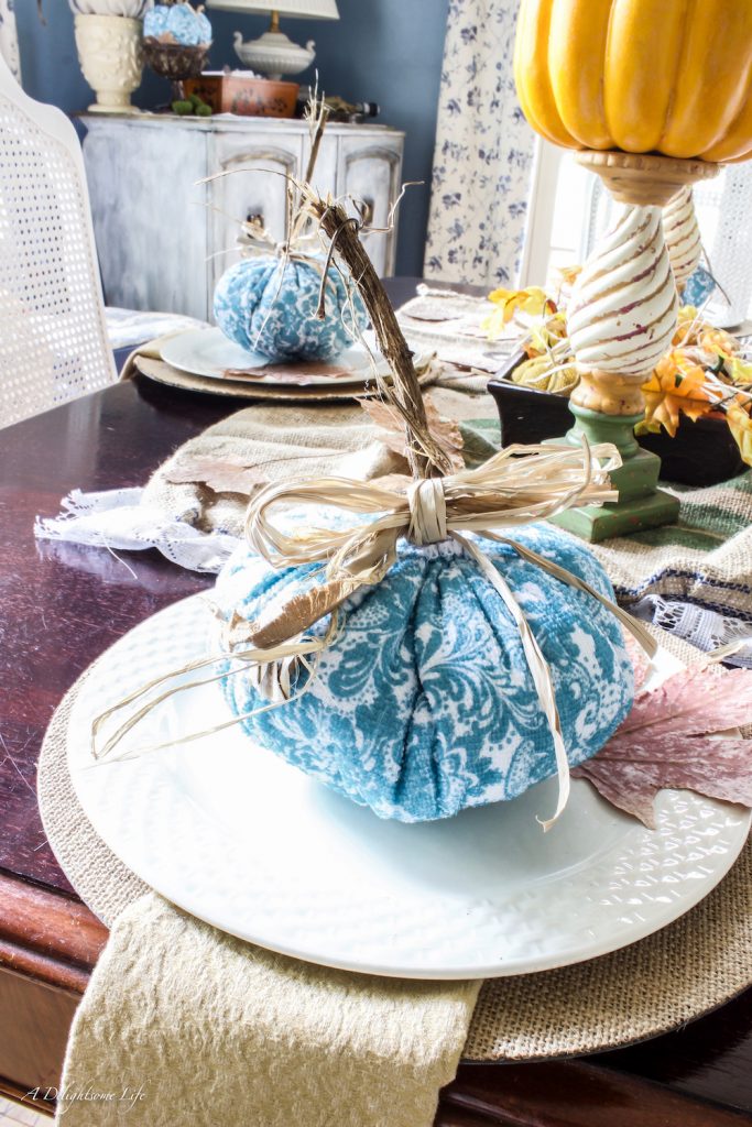 blue, white and orange fall decor in the dining room at A Delightsome Life