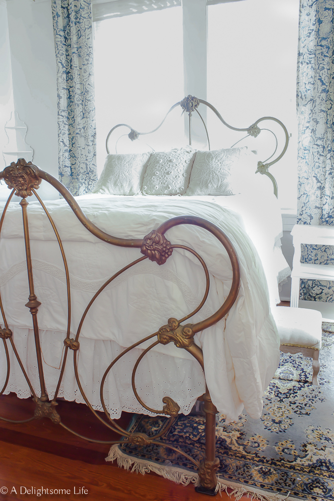 antique cast iron bed in guest bedroom on A Delightsome Life
