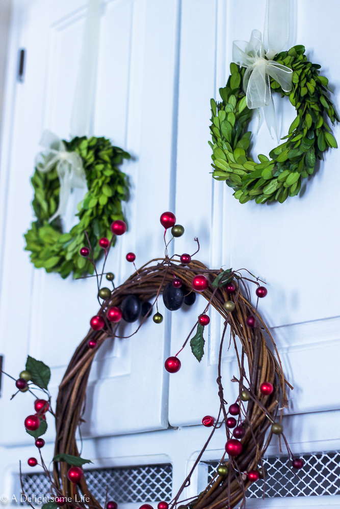 Boxwood Wreaths from Decor Steals decorated for Christmas on A Delightsome Life