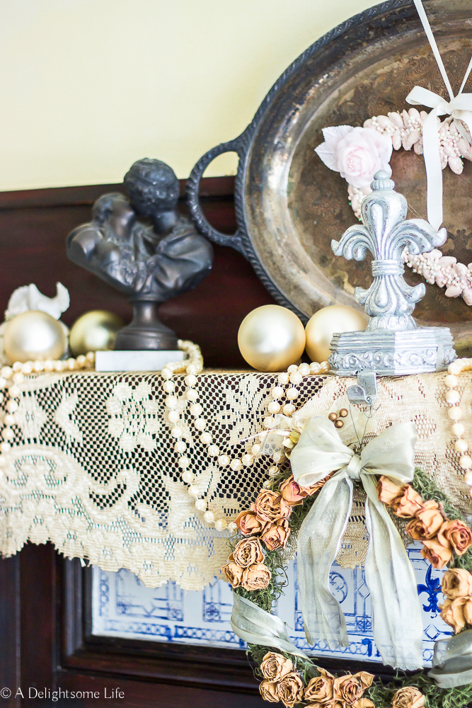 lace runner decorates Master bedroom mantel for Christmas on A Delightsome Life