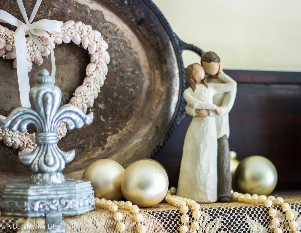 Willow tree figurine demonstrates love on mantel in Master bedroom on A Delightsome Life