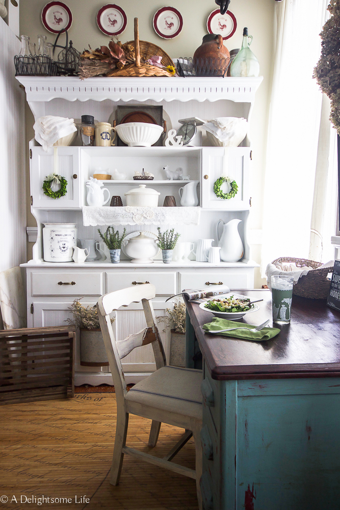 The kitchen hutch styled in French Farmhouse decor on A Delightsome Life