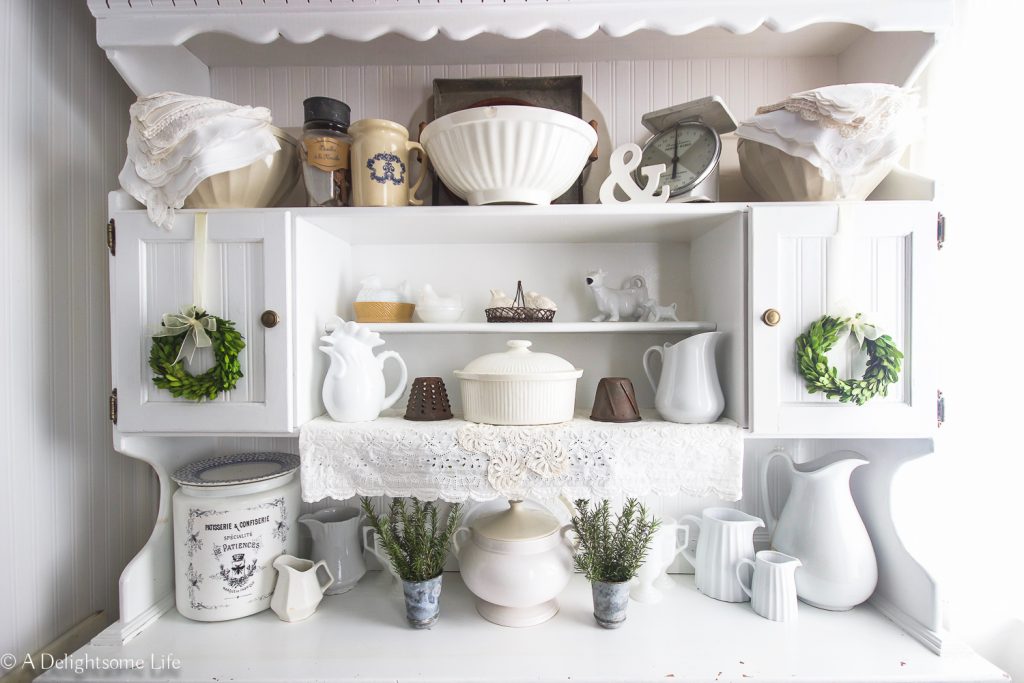 Deciding on what items to include in styling kitchen hutch in French Farmhouse style on A Delightsome Life