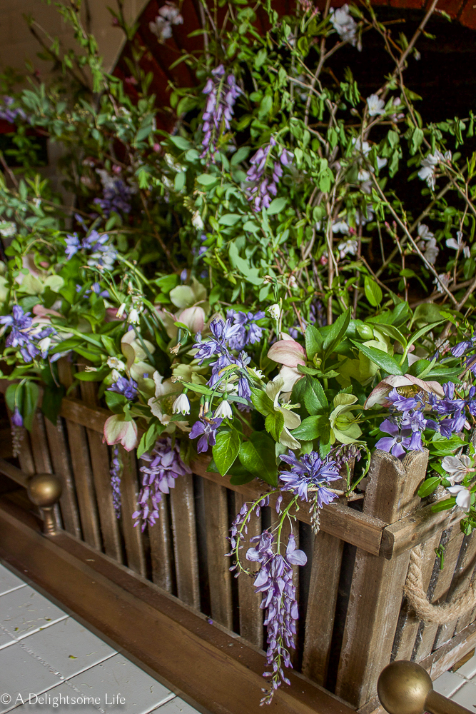 Wisteria blossoms in a rustic floral Spring arrangement
